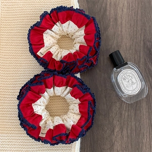 Retro red polka dot scrunchies set with navy lace trim and elegant fabric texture