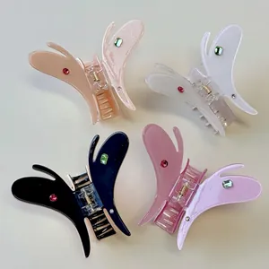 Pinces à cheveux papillon en acétate avec strass colorés en crème, blanc et bleu