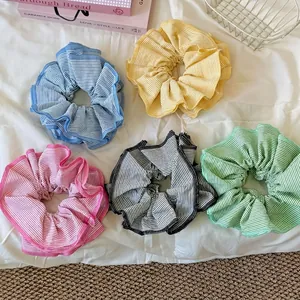 Five-pack set of colorful striped oversized scrunchies with vibrant wavy pleats