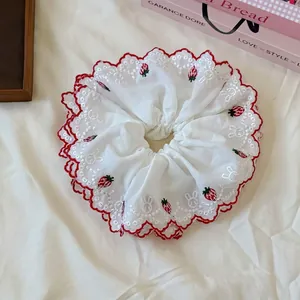 Oversized white hair scrunchie with embroidered strawberries and red wavy edges