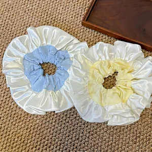 Set of two large oversized satin scrunchies in blue and yellow with white polka dots