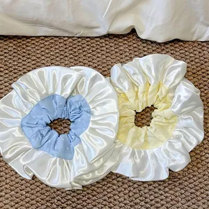 Oversized French satin scrunchies with white polka dots in light blue and yellow