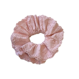 Pink lace bow scrunchie with embroidered hollow-out edges and soft cotton pleated texture