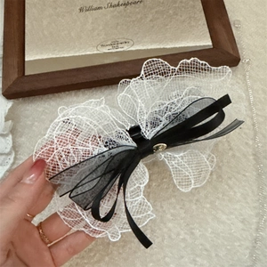 Lace bow hair claw clip with black and white ribbons for high ponytail styling