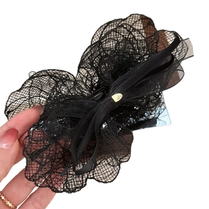 Elegant black lace bow hair claw clip with golden logo for high ponytail hair styling