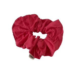 Vibrant red fabric scrunchie with FMdrea woven label for ponytails and buns