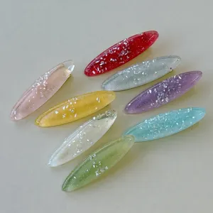 Set of 8 colorful resin oval hair clips with sparkling glitter on a neutral surface