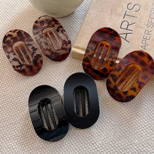 Set of 6 minimalist oval hair clips in tortoise shell, matte, and glossy black finishes