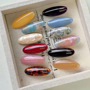 Set di 12 fermagli per capelli ovali in acetato dai colori macaron e loghi oro