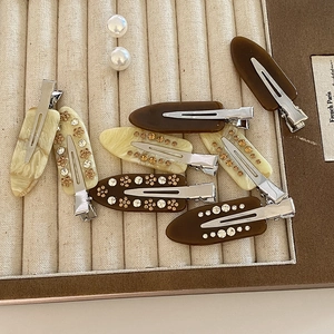 French retro acetate floral rhinestone hair clips set in marble and cream colors