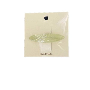 Fermaglio per capelli ovale in resina verde con texture a conchiglia e glitter