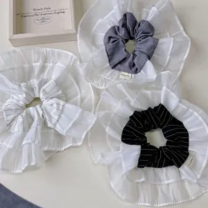 Three-piece set of layered ruffle hair scrunchies in black and grey chiffon material