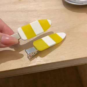 Set of two yellow and white striped acetate hair clips with metal duckbill base