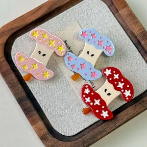 Barrettes à cheveux trognon de pomme avec étoiles en rose bleu et rouge en acétate