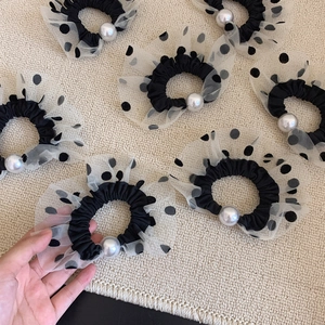 French vintage black hair scrunchie with white polka dot lace and a large white pearl