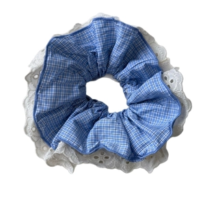 Sweet Korean blue checkered scrunchie with delicate white lace trim on white background
