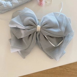 Elegant grey plaid tulle bow hair claw with crystal pendant on white surface