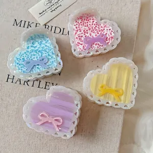 Set of four sweet acetate heart hair claws with lace patterns and ribbon accents