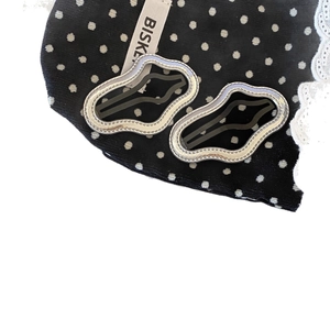 Silver metallic wave-shaped BB hair clips with textured edges and black hollow design