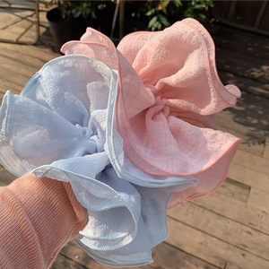 Oversized French pleated scrunchies in pink and light blue chiffon for chic low bun styles