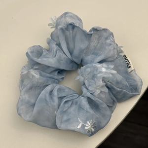 Light blue mesh scrunchie with 3D white flower embroidery and a soft fabric finish