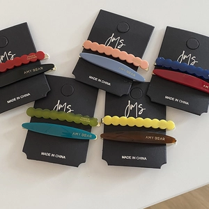 Minimalist colorful acetate hair clips set with wavy and oval shapes on display card