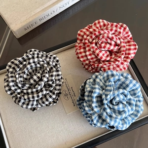 Elegant plaid fabric rose hair claw clips in black, red and blue checkers for women