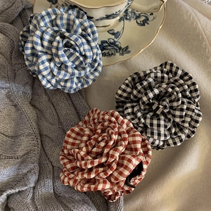 Elegant plaid fabric rose hair claw clips in blue, black, and red checkered patterns
