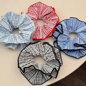 Chic striped oversized hair scrunchies set in four colors for elegant hair styling
