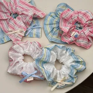 Sweet blue and pink striped scrunchies set with lace and bows for girls' hair styling