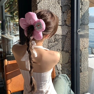 Pink and white striped floral hair scrunchie with 3D flower on braided hairstyle