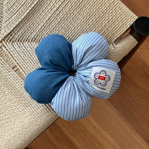 Detailed view of large denim striped floral hair scrunchie with 24C Coloration label