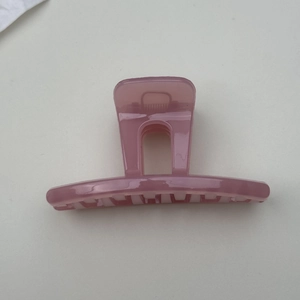 Minimalist jelly pink hair claw clip with elegant translucent finish for women