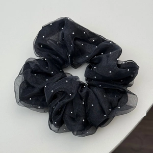 Detail of black double-layered mesh hair scrunchie with silver sparkling rhinestones