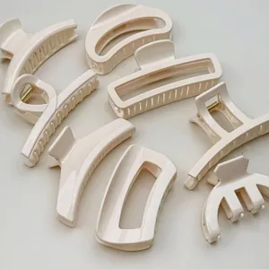 Minimalist cream white hair claw clips in various geometric shapes for women