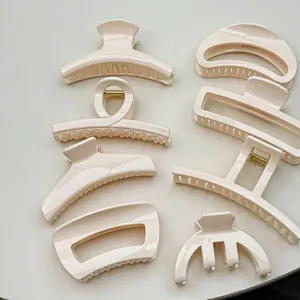 Minimalist cream white hair claw clips set in various geometric resin styles for women