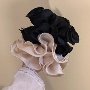 Oversized satin hair scrunchies set in black and cream with elegant ruffled layered design