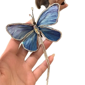 Barrette papillon bleu exquise avec strass et élégants pompons à franges longs