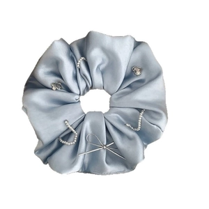 Elegant light blue satin scrunchie with pearls, heart charms and silver metal accents