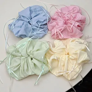 Pastel ballet-style oversized scrunchies with long ribbons in four macaron colors