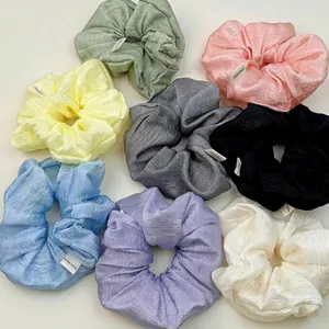 Set of 8 colorful pleated satin hair scrunchies with Hand Made label in pastel colors