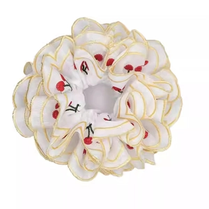 Sweet white fabric scrunchie with red cherry embroidery and yellow wavy edges