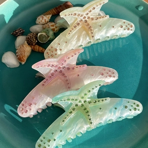 Mollette per capelli a forma di stella marina in acetato con perle e strass luccicanti