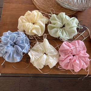 Set of 5 pastel French bow scrunchies with ribbons on vintage wooden background