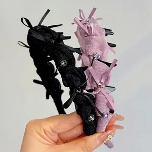 Cerchietto con fiocco e strass scintillanti nero e rosa per acconciatura volumizzante