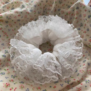 Elegant multi-layered white lace scrunchie with romantic ruffled edges for women