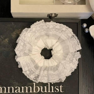 Elegant white lace scrunchie with layered pleated mesh and delicate heart embroidery