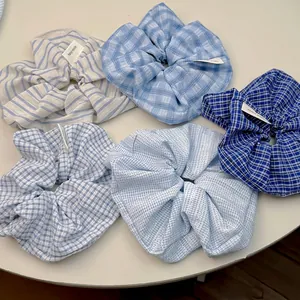 Set of five blue and white gingham check scrunchies with retro French cotton fabric style