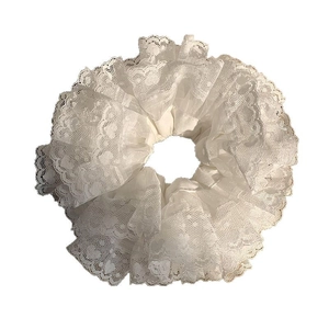 Elegant white lace ruffled hair scrunchie with sheer mesh layers and scalloped edge detail