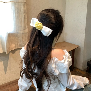 Elegant white satin bow hair clip with yellow rose flower for half-up hairstyles